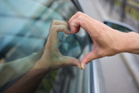Allow yourself to feel a deep sense of love and connection while looking through the window of a carの写真素材