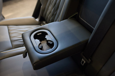 Vehicle armrest with cup holder, beige design, for luxury cars