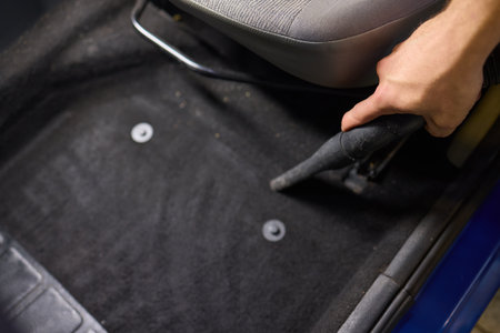 Car interior cleaning includes thorough cleaning under pedals for a tidy interiorの写真素材