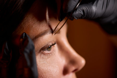 The illustrious Precision Eyebrow Microblading Process conducted expertly in a Salon Environmentの写真素材