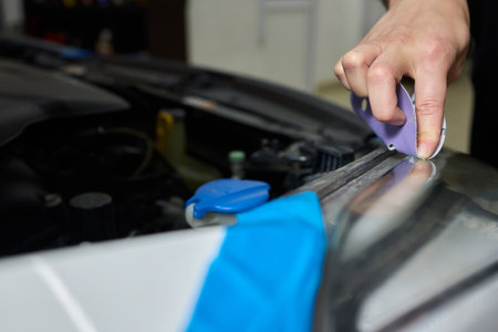 Applying a Protective Film on Your Cars Headlight for Enhanced Longevity and Safetyの写真素材