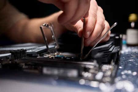 Hands Engaged in the Process of Working on Computer Hardware Installation and Upgrading