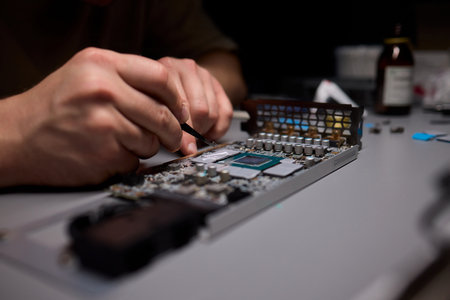 Hand Repairing a Graphics Card through the Application of Thermal Paste for Better Performance