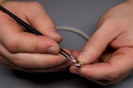 Repairing Earbuds Close Up of Effective Cable Maintenance Techniques and Tips for Success