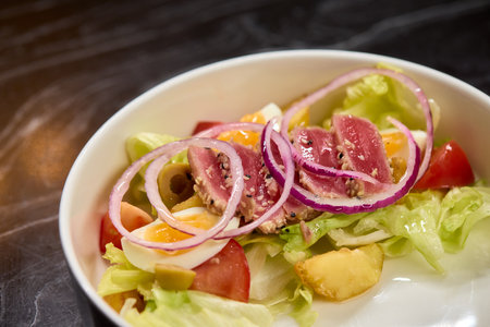 A Fresh and Colorful Salad with a Variety of Fresh Vegetables and Sliced Onions Includedの写真素材