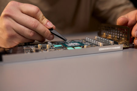 Hand Repairing a Graphics Card through the Application of Thermal Paste for Better Performance