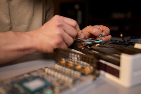 Hand Repairing a Graphics Card through the Application of Thermal Paste for Better Performance