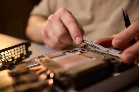 Hand Repairing a Graphics Card through the Application of Thermal Paste for Better Performance