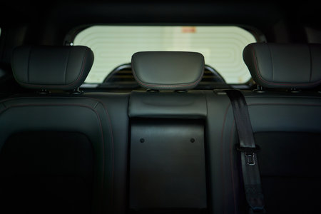Car back seat with headrest and arm rest, a comfortable automotive fixtureの写真素材