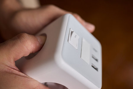 A closeup view of a hand skillfully adjusting a button on a modern, advanced device