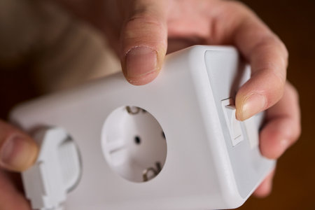 A closeup view of a hand skillfully adjusting a button on a modern, advanced device