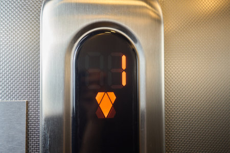 The modern elevator control panel features a display showcasing the current floor numberの写真素材