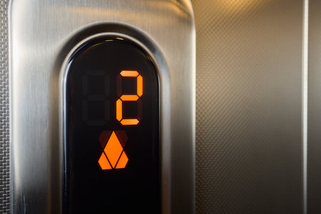The modern elevator control panel features a display showcasing the current floor numberの写真素材