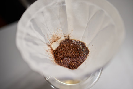 Brewing a delectable cup of Coffee using a Drip Filter technique enhances the entire experienceの写真素材