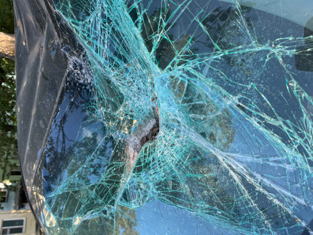 An Intricate Close Up View of Cracked Glass Featuring a Unique Spiderweb Pattern Design