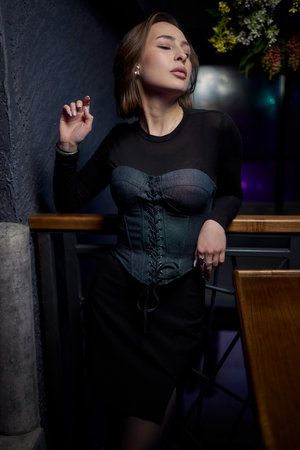 A Contemporary Portrait Featuring a Woman Captured in Striking and Dramatic Lightingの写真素材