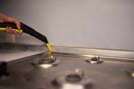 Utilize Efficient Steam Cleaning for Maintaining the Cleanliness of Stovetop Surfacesの写真素材