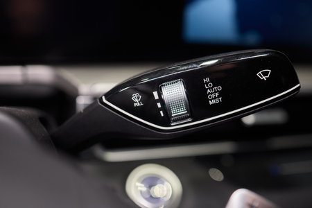 A detailed closeup view of the interior of a car, showcasing various controls and features