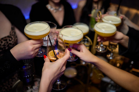 Cheers to a Fantastic Celebration Friends Joyfully Toasting with Wine Glasses in Hand