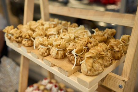 An Elegant Assortment of Gourmet Desserts and Savory Snacks Beautifully Arranged on Tableの写真素材