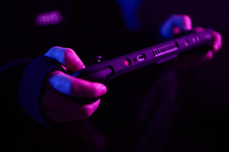 Enjoy an exciting gaming session with a handheld console full of thrills and adventuresの写真素材