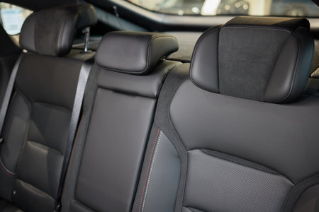 Car back seat with headrest and arm rest, a comfortable automotive fixtureの写真素材