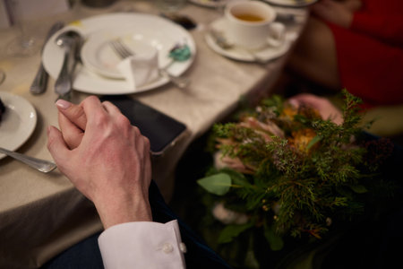Elegant Wedding Rings and Hands In Close Up At A Beautiful Ceremony Celebrating Loveの写真素材