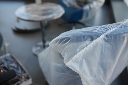 Plastic covered chairs in a modern office setting create an intriguing aesthetic