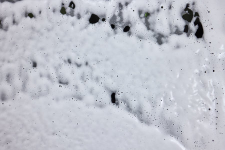 Suds and Streaks on a Smoothly Polished Surface, highlighting the beauty of cleanliness and detailの写真素材