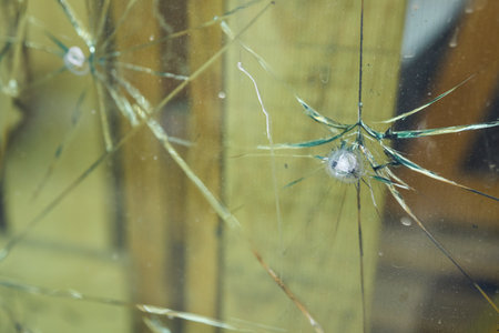 An Intricate Close Up View of Cracked Glass Featuring a Unique Spiderweb Pattern Design