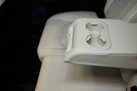 Vehicle armrest with cup holder, beige design, for luxury cars