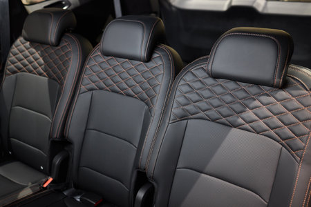 Car back seat with headrest and arm rest, a comfortable automotive fixtureの写真素材