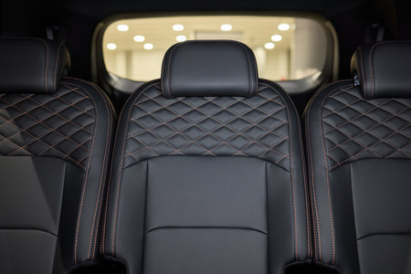 Car back seat with headrest and arm rest, a comfortable automotive fixtureの写真素材