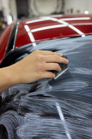 Car Detailing Meticulously Cleaning Your Windshield with Care for an Immaculate Appearanceの写真素材