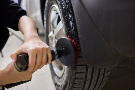 Utilizing a Power Tool for Cleaning Tires to Achieve Improved Appearance and Maintenanceの写真素材