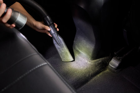Providing car interior vacuuming services ensures cleanliness and hygiene in automobilesの写真素材