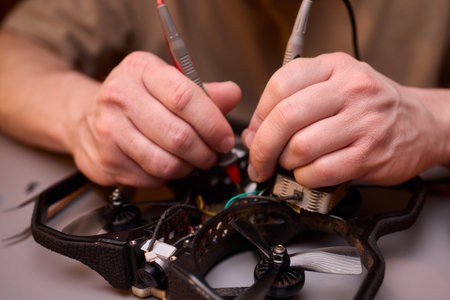 The detailed Drone Repair Process carried out meticulously in a specialized workshop setupの写真素材