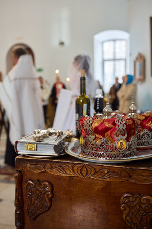 A ceremonial table with a crown and wine, symbolizing faith and community connectionの写真素材