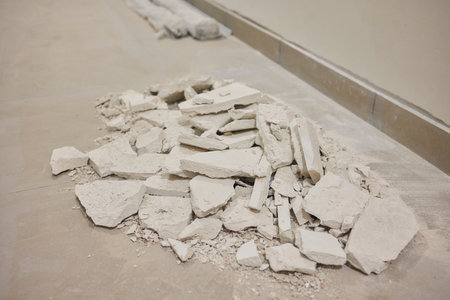 Construction debris is scattered across the floor after the recent renovation workの写真素材