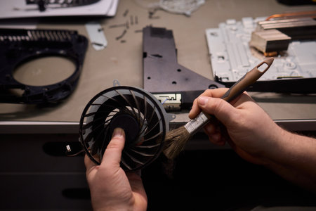 A Close Up and Detailed Examination of a Turbine Fan Component Held in Hand for Reviewの写真素材