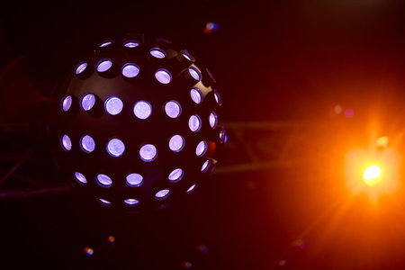 Experience the vibrant disco ball lights that truly enhance the nightlife atmosphere and energyの写真素材