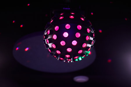 Experience the vibrant disco ball lights that truly enhance the nightlife atmosphere and energyの写真素材