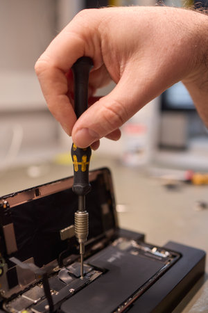 Expert Smartphone Repair Using Advanced Precision Tools for Optimal Performance and Qualityの写真素材