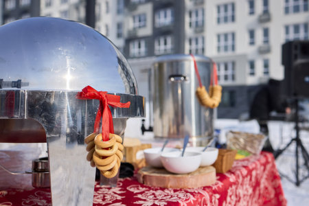 A traditional Samovar paired with bagels displayed against a vibrant urban backdropの写真素材