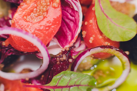 Green Avocado and Tomato Salad with Onions.の写真素材