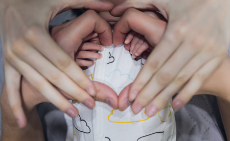 Baby Hand, Father Hold New Born Kid, Parent Touch Newborn Child, Family Help Care Concept.の写真素材