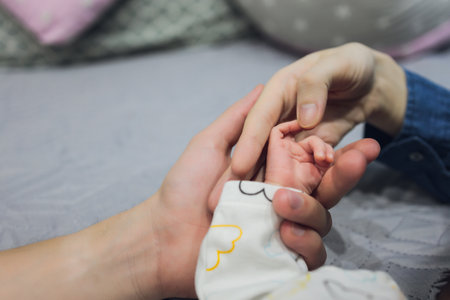Baby Hand, Father Hold New Born Kid, Parent Touch Newborn Child, Family Help Care Concept.の写真素材