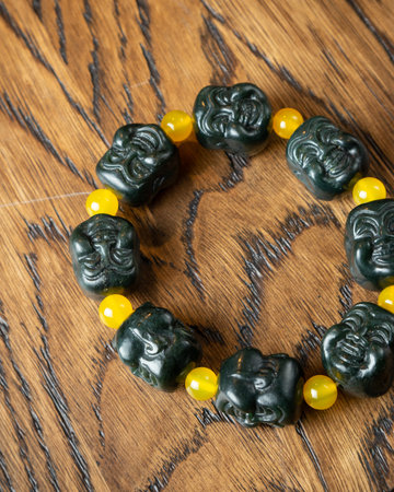 Colorful beads made of natural semiprecious stones on a white background. Isolated jewelry close up. Stone texture, beaded necklaces, rock.の写真素材
