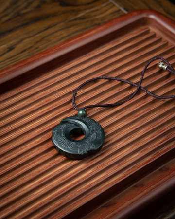Colorful beads made of natural semiprecious stones on a white background. Isolated jewelry close up. Stone texture, beaded necklaces, rock.の写真素材