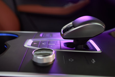 Selector automatic transmission with leather in the interior of a modern car. The background is blurred. Black and brown leather car.の写真素材